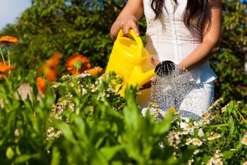 Trained gardeners in Pentonville using protective equipment